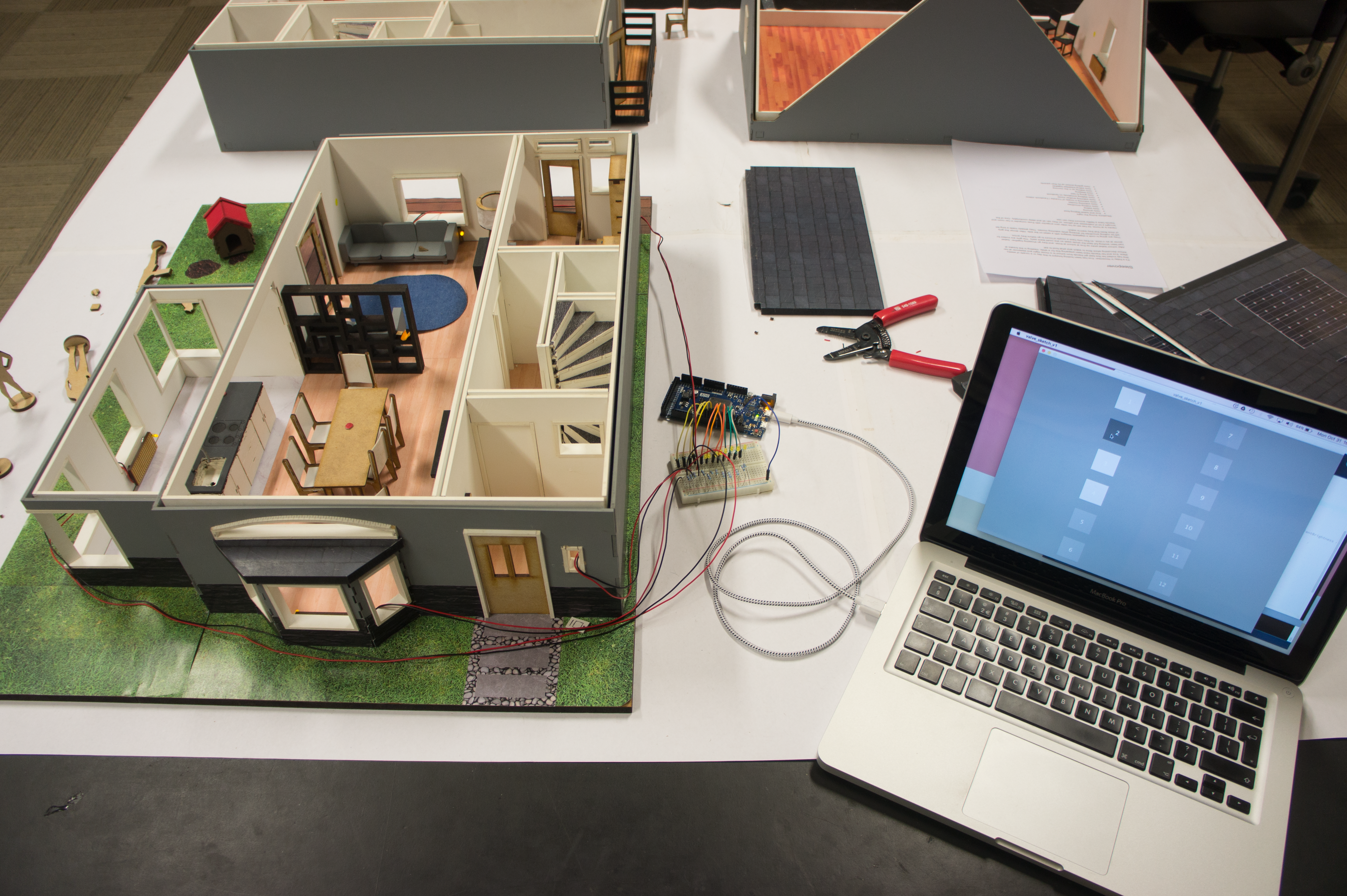 miniature implementations of the 'connected system' were added to the model house to symulate interaction with other systems